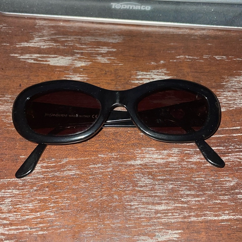 Yves Saint Laurent 6563 Y505 black sunglasses with heart accent on arm.